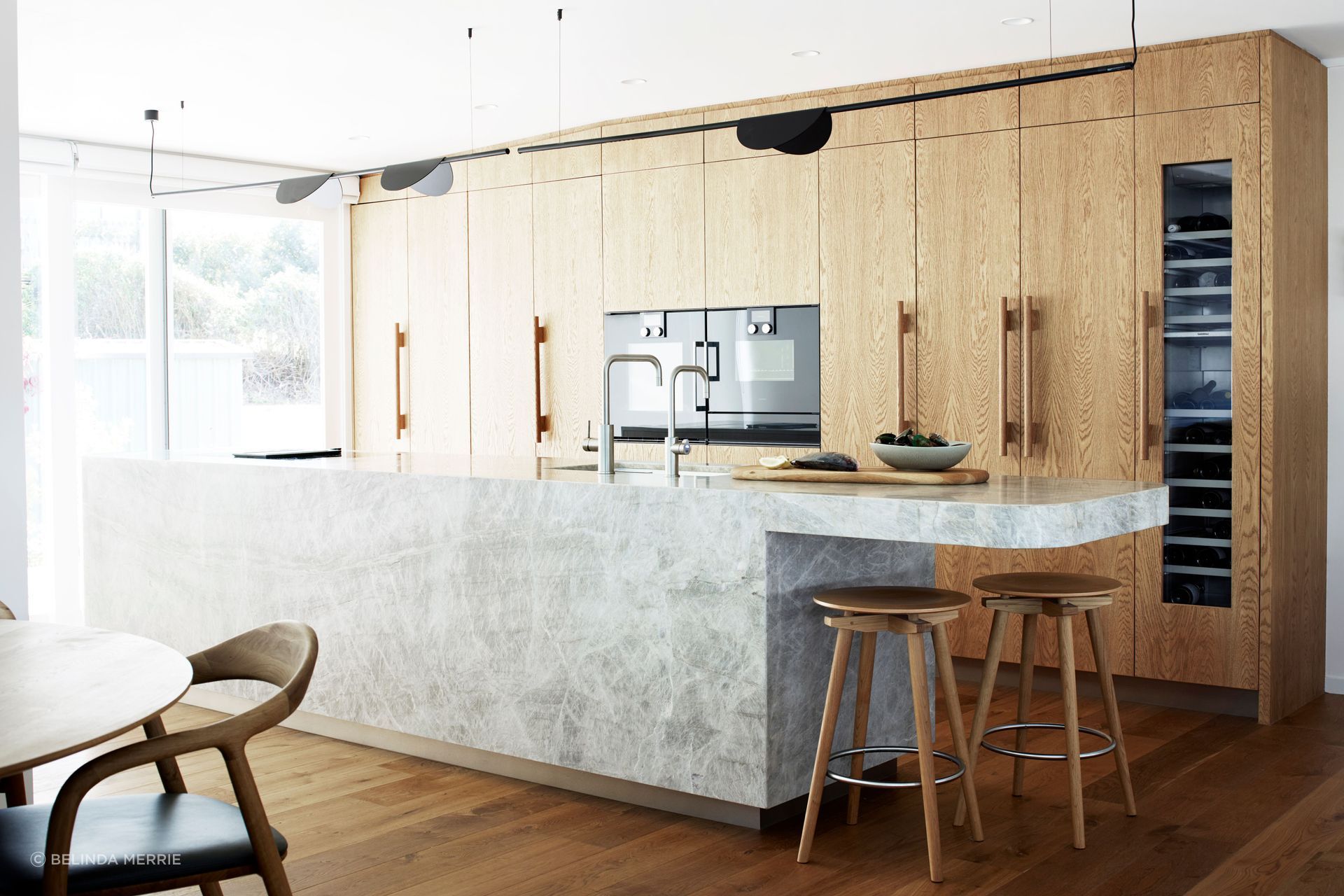 The kitchen in this Leigh holiday home, renovated by Natalie Du Bois of Du Bois Design. The original kitchen was a U-shaped configuration and tucked into an alcove. Natalie opted instead to open up to the living area in a galley style.