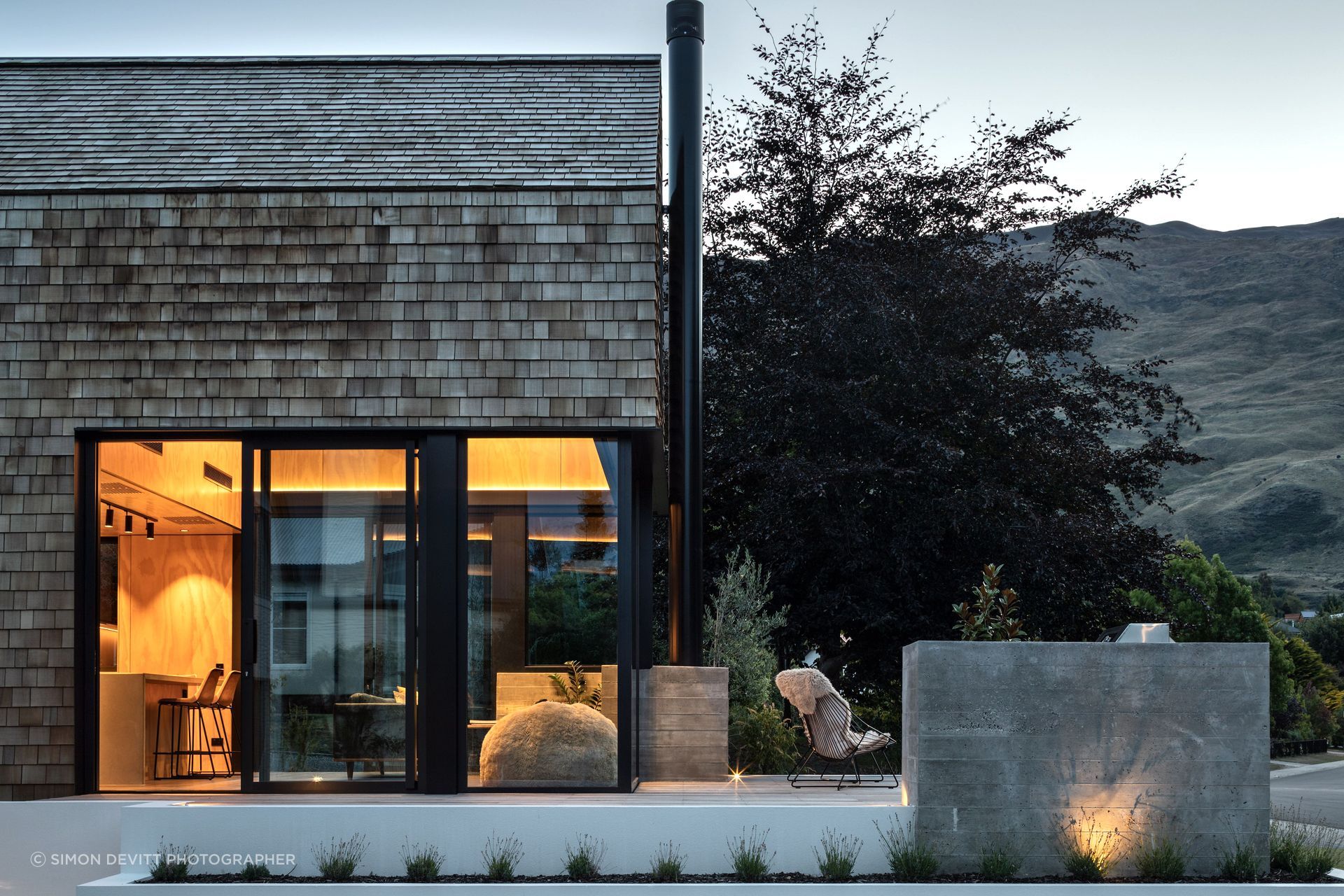 The cedar shingles are low-maintenance, ideal for the family that travels a lot, and the deck and glazing are perfectly designed to balance privacy while capturing views of Wanaka.