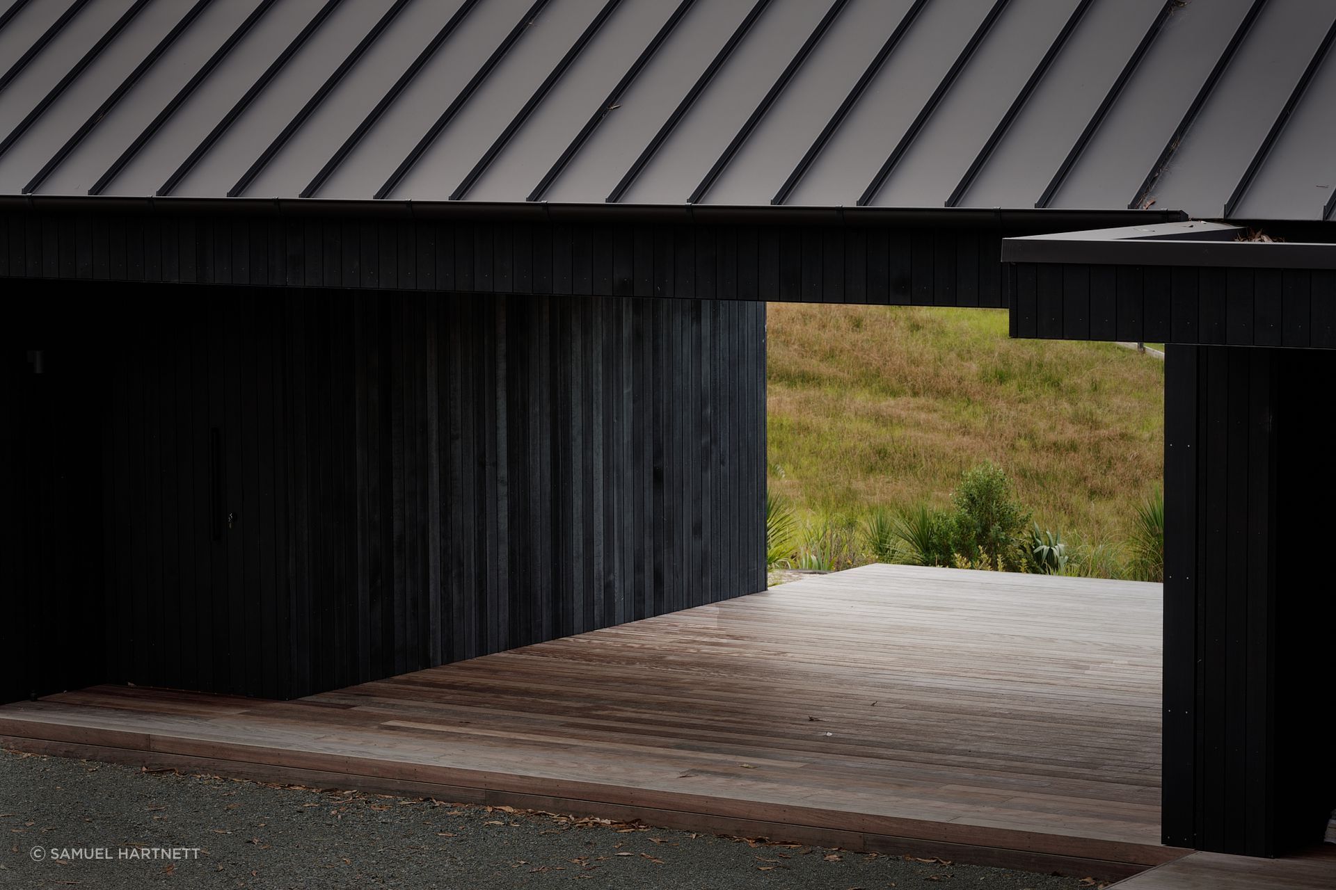 Almost the entire exterior is clad in striking black quarter sawn vertical cedar timber.