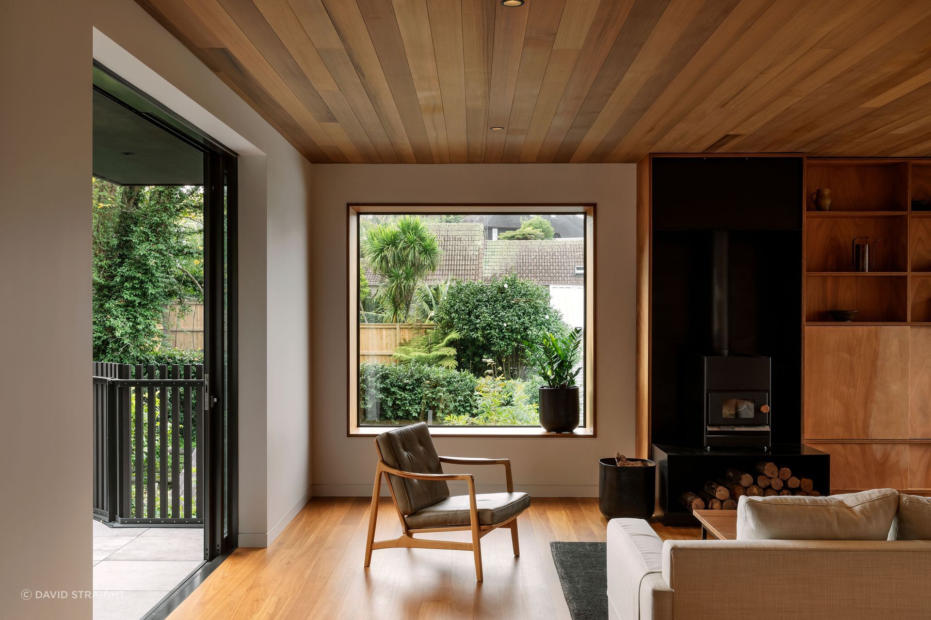 Gaboon ply is used throughout the house and ties everything to the living area. The Pyro Classic wood burner by Pyro Fires anchors the seating area.