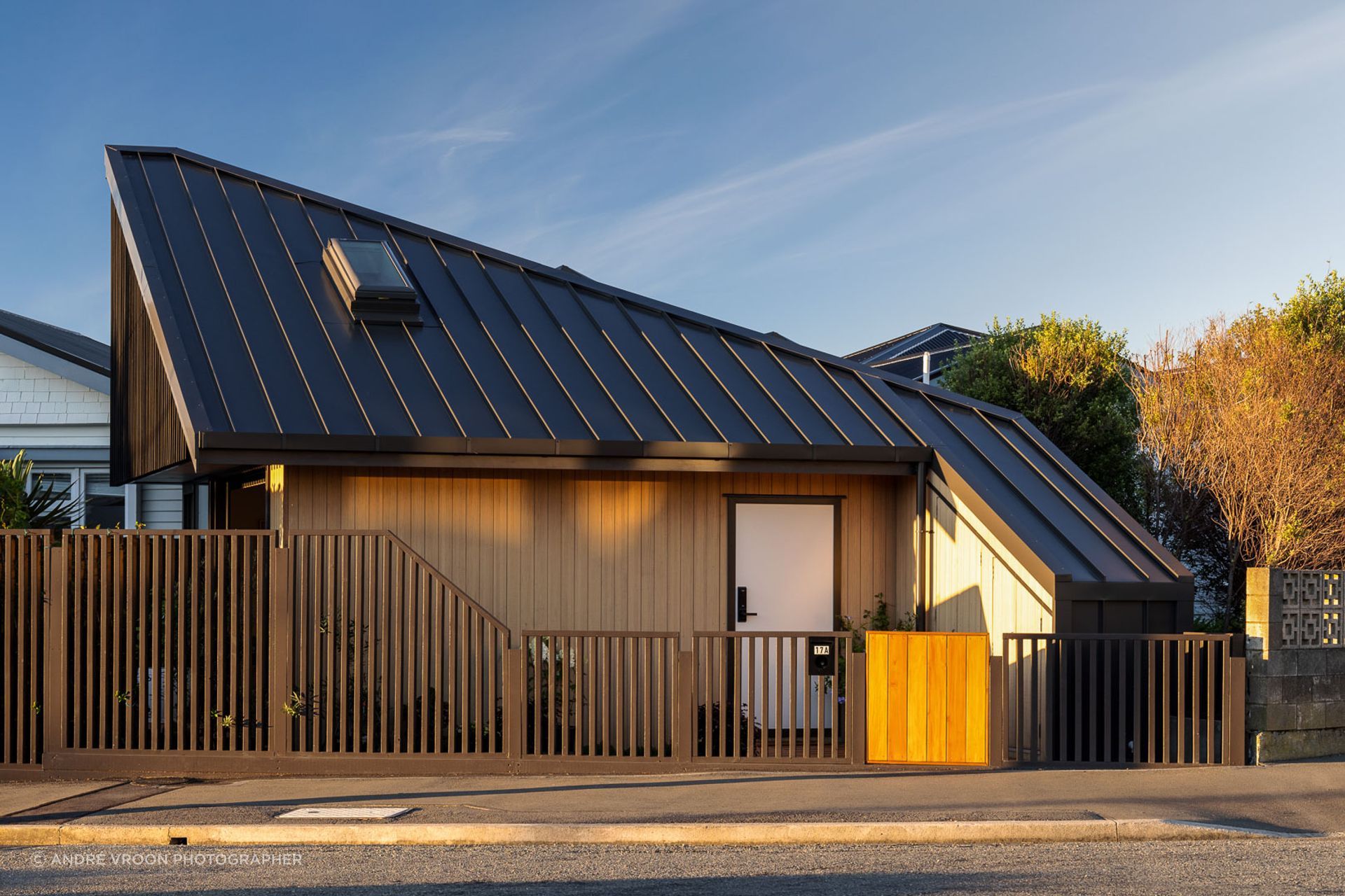 From the street, the compact home cuts a striking form.