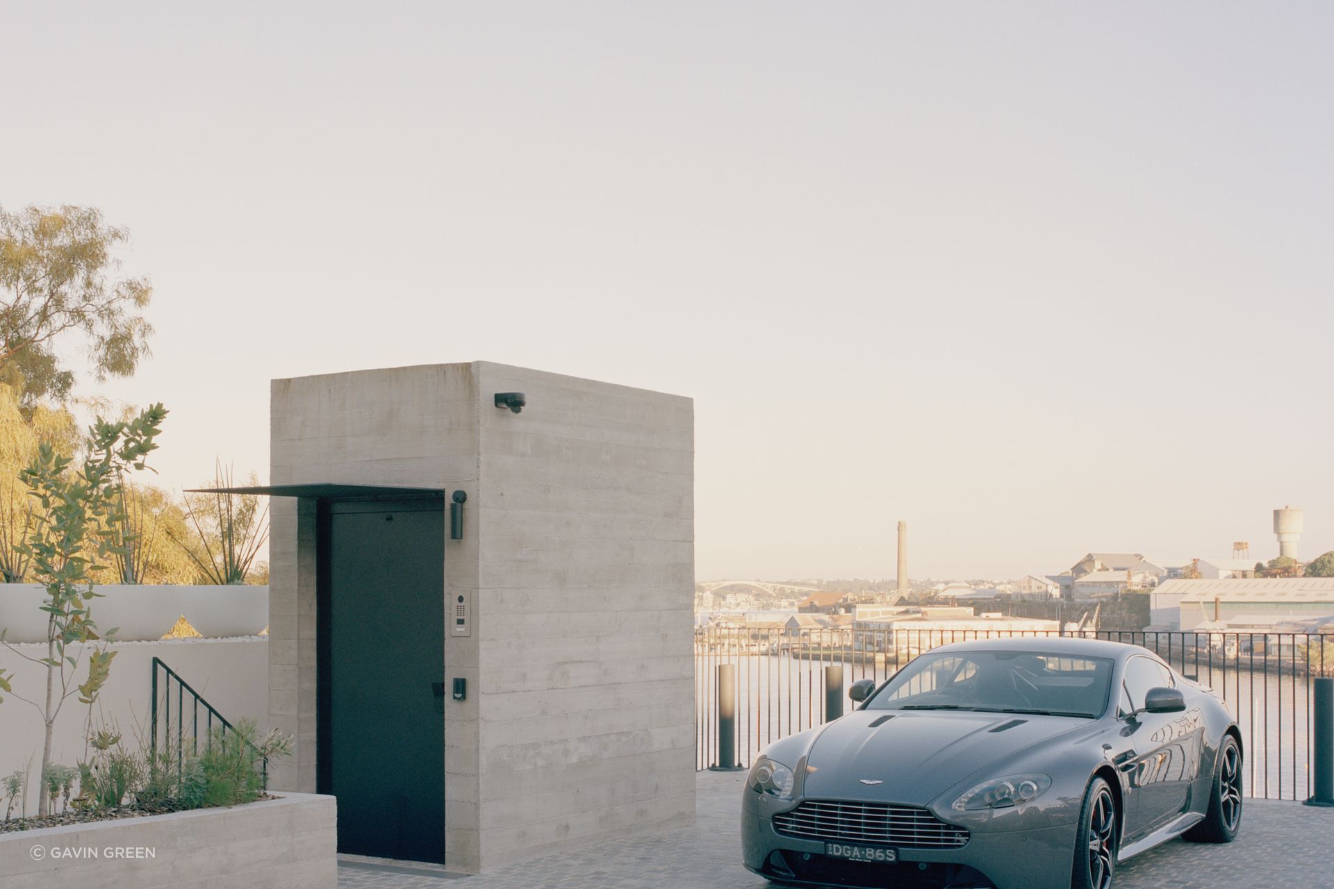 The lift protruding from the concrete form at street level is the only indication of the jaw-dropping structure below.