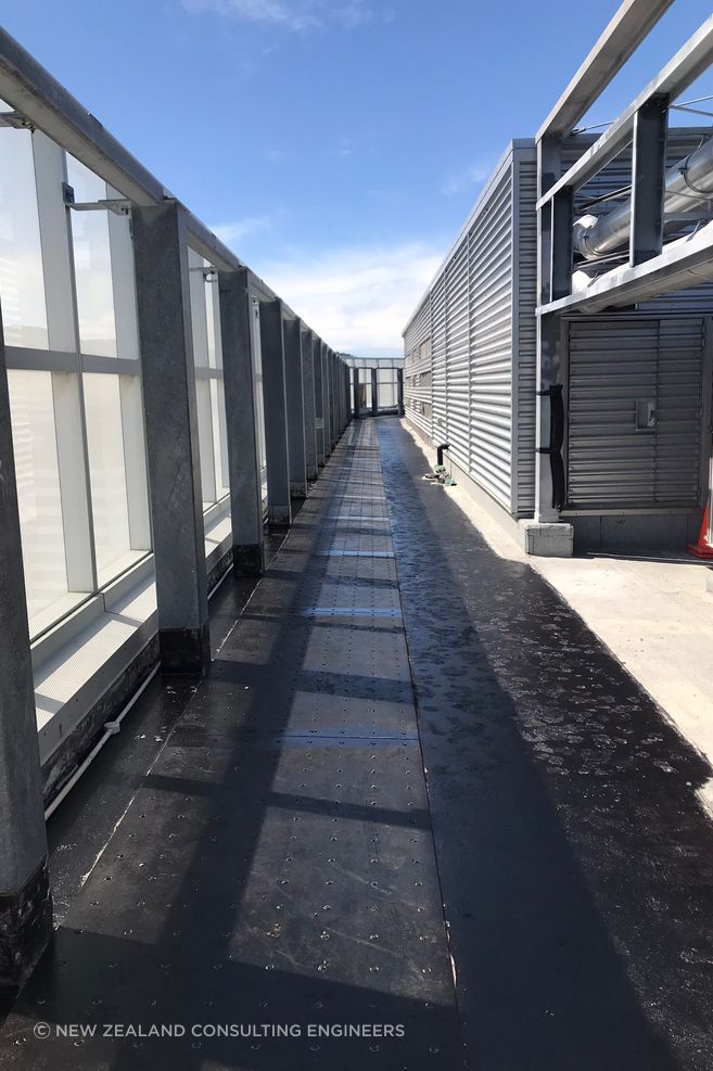 "At the roof level the steel plates had to increase to 12mm and 16mm thickness, with a large 1500mm deep and 850mm wide concrete collar installed around the core of the building to allow for the diaphragm forces to be transferred into the core."