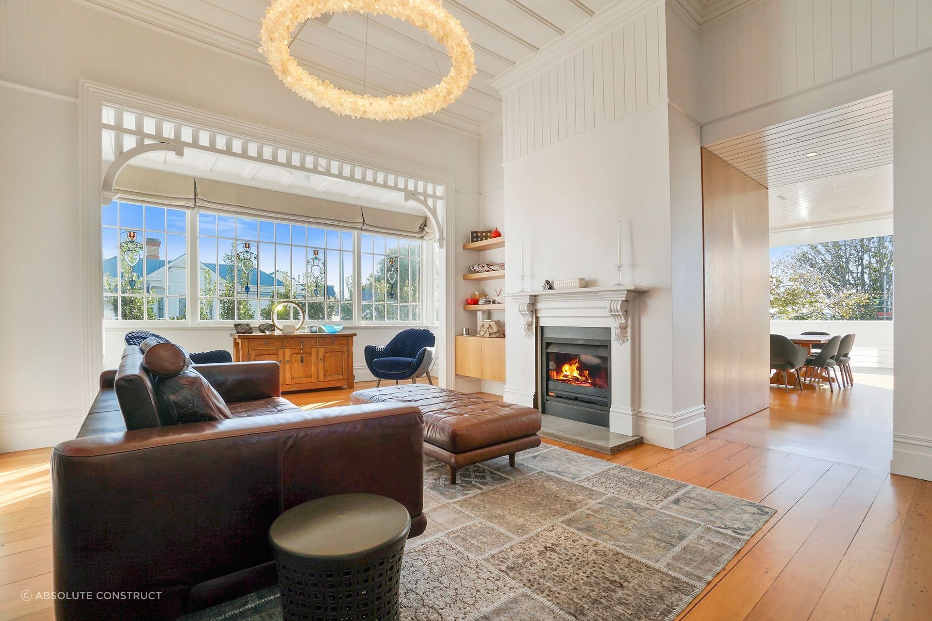 A living room that exudes warmth, thanks in no small part to the statement fireplace.