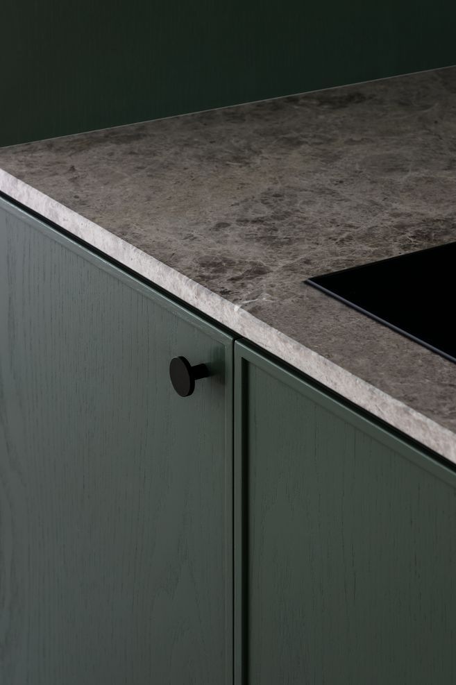 Wood grain cabinetry and marble bench tops add interest and texture.