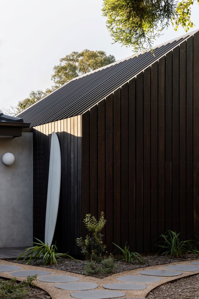 Clad in spotted gum the extension blends with the rendered exterior.