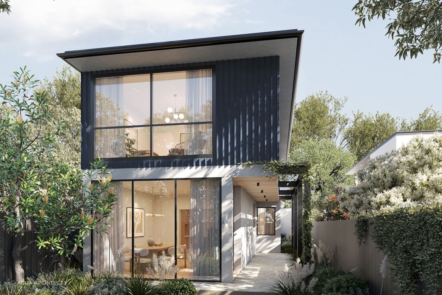 Surrounded by a garden oasis, the home embraces the greenery and natural light through floor-to-ceiling windows in the downstairs living space.