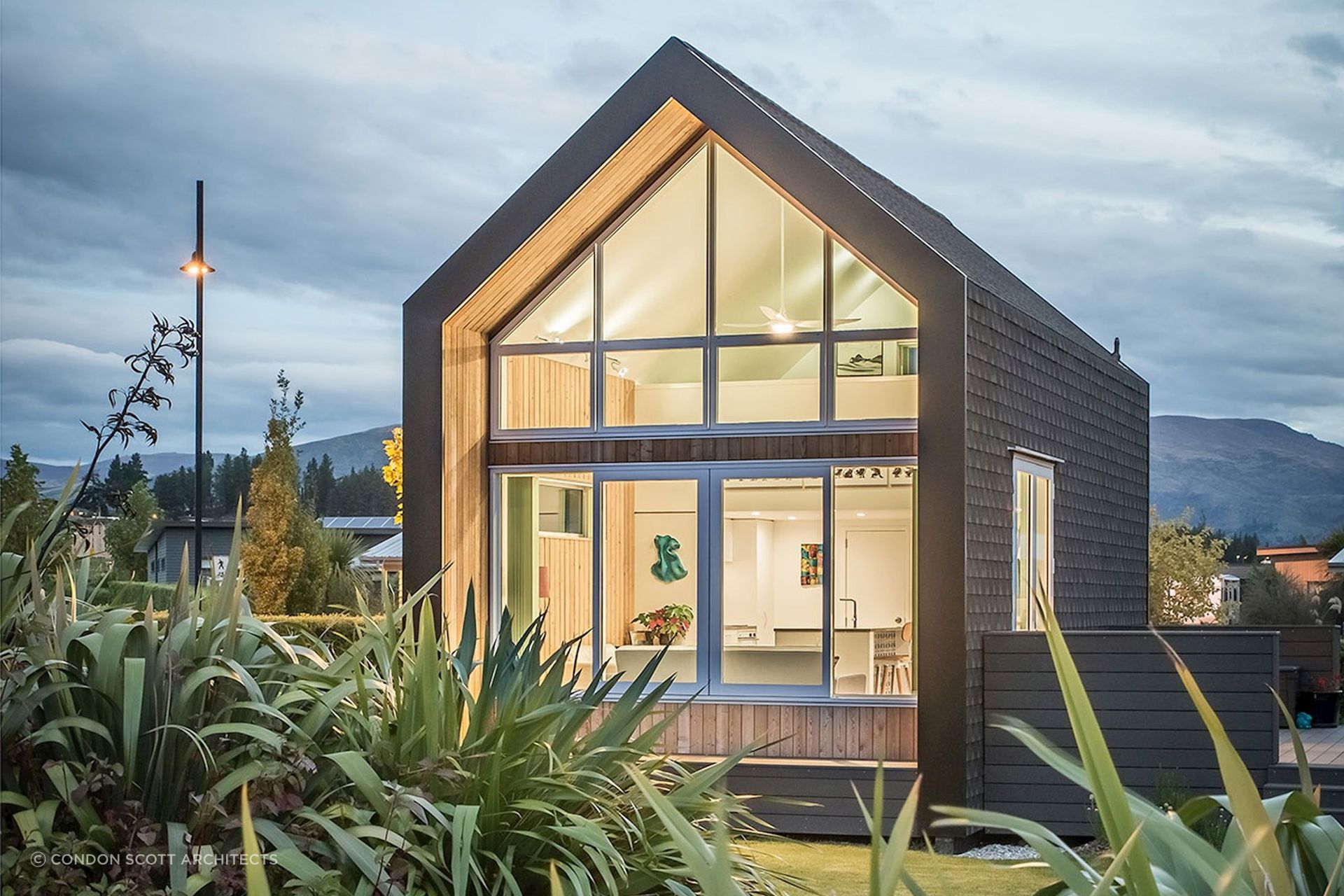 Lighting shows the interior of the Kimimoko Tiny House by Condon Scott Architects in all its glory