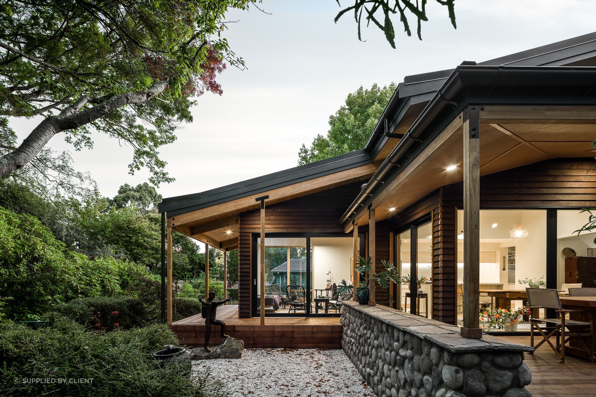 The exterior material palette includes Riverstone and darkly-stained West Coast beech weatherboards in a nod to 'Los Angeles'.