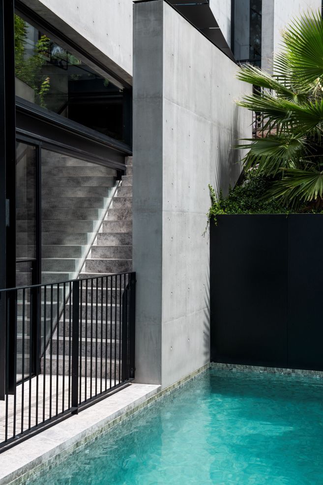 The pool is adjacent to the playroom and music room downstairs.