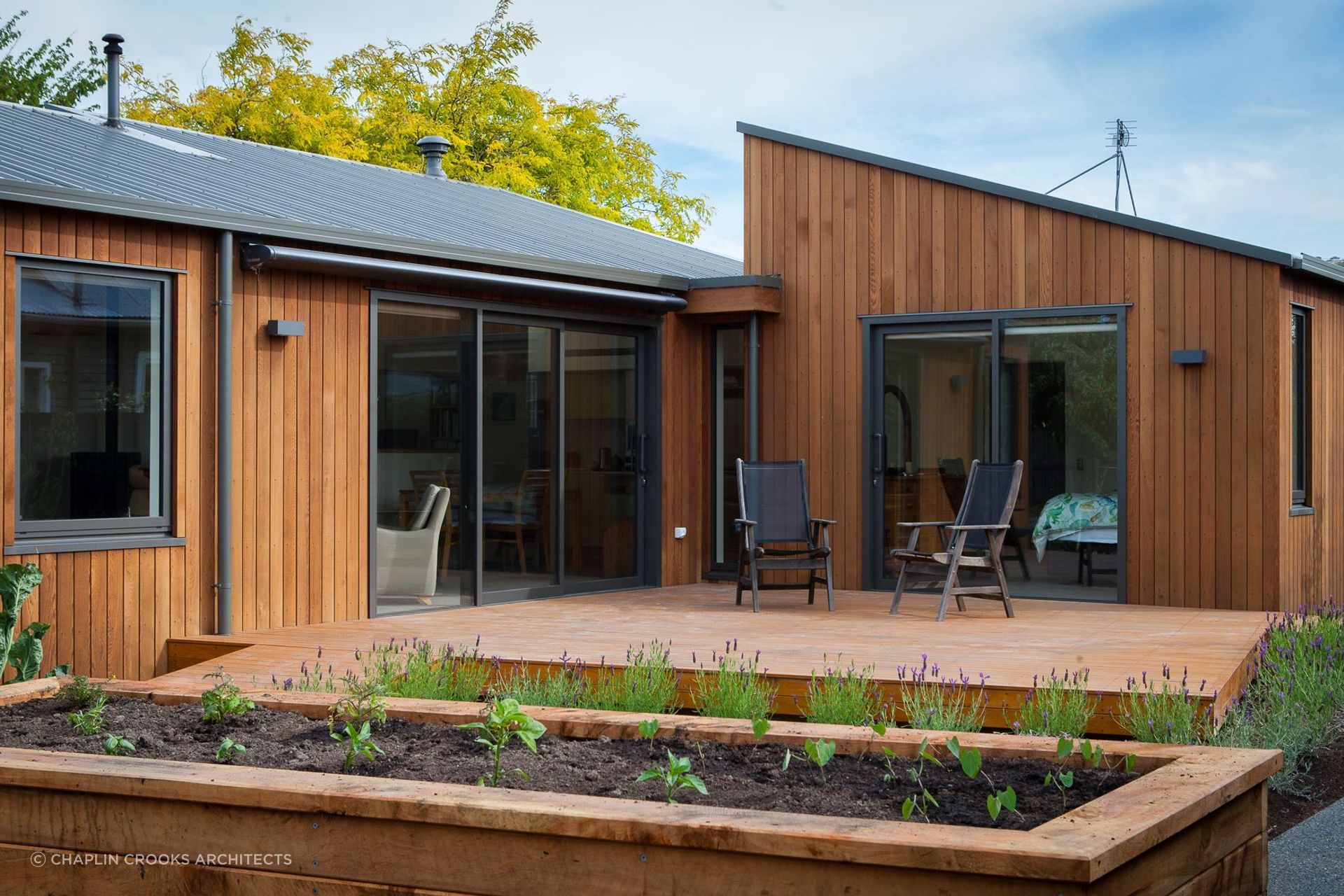 A lovely little deck and garden space awaits for comfortable outdoor living.