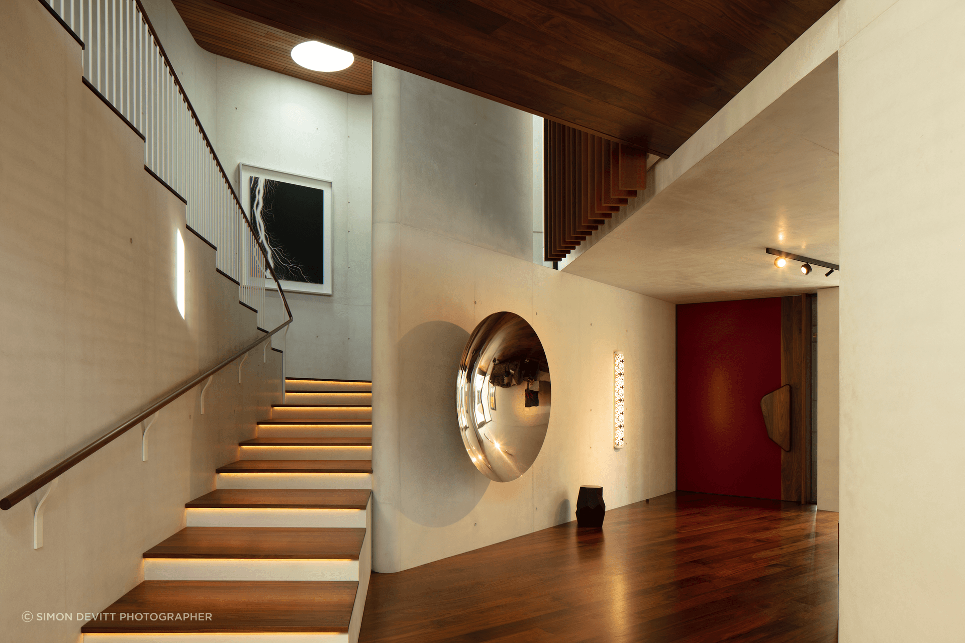A piece of art in itself, this home also features many artworks by local and international artists – backdropped by the stunning white concrete surfaces.