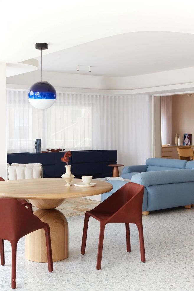 The terrazzo floor acts as a gorgeous canvas for the furniture to deliver a contemporary twist on 1980s style.
