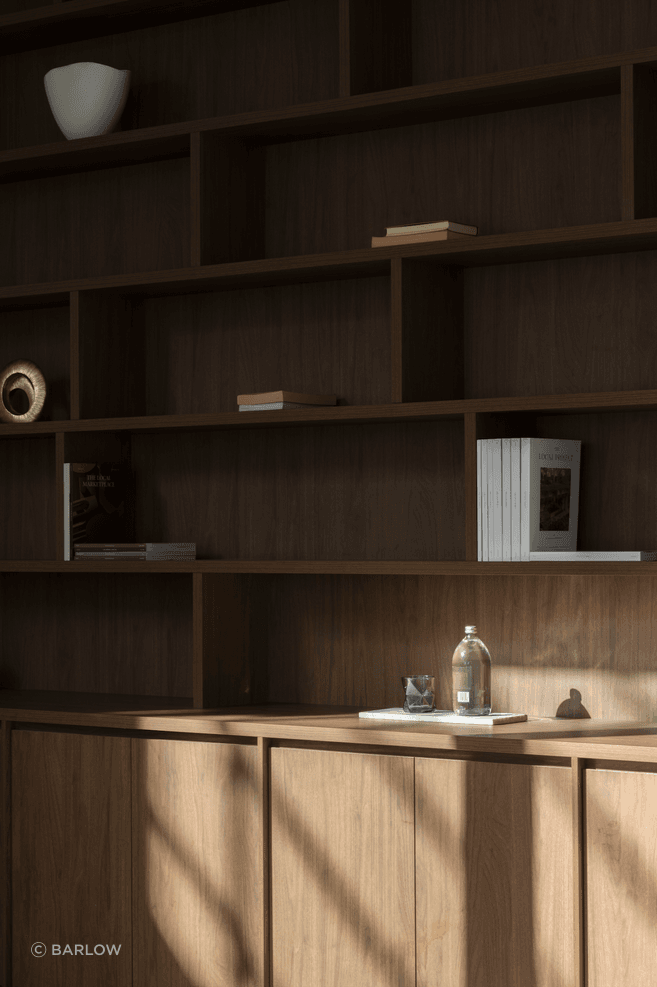 The same dark timber as the kitchen cabinetry has been selected for the study.