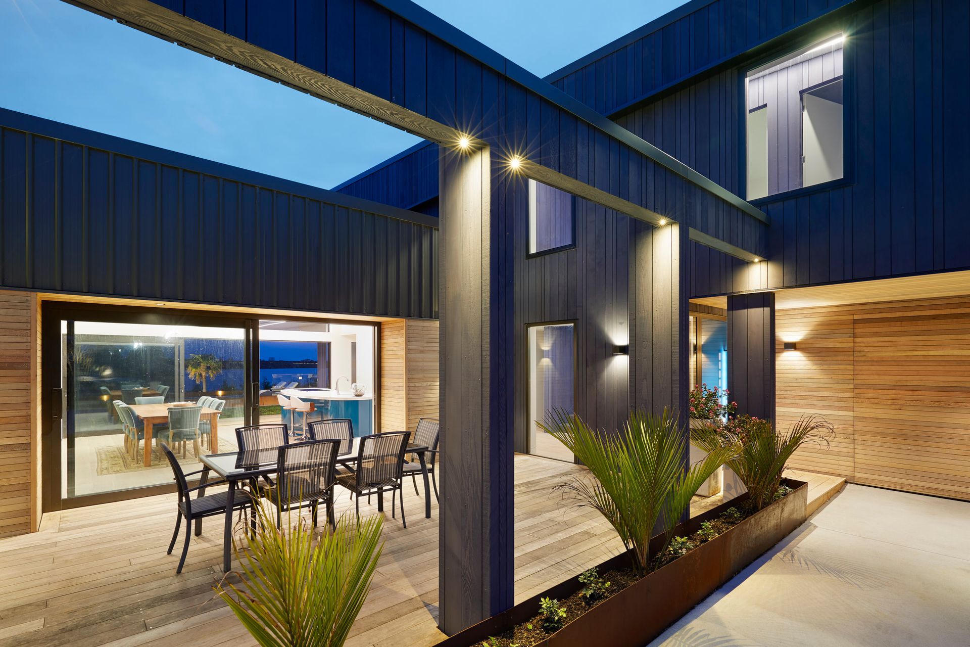 The three bedroom, two bathroom home is built for lifestyle and entertaining with open plan kitchen, living and dining opening out onto three covered outdoor areas and a stunning pool with surrounding deck built into the landscape and surrounded by Corten