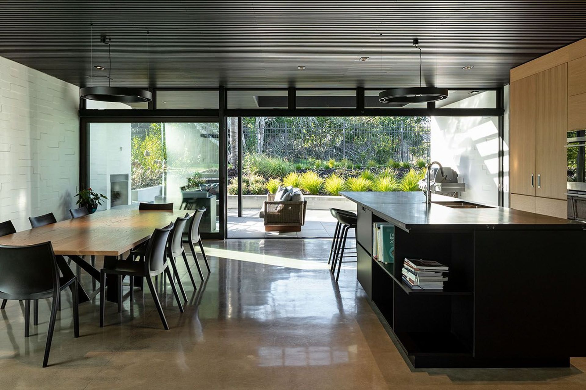 The rear entertaining courtyard draws on a close link to the adjoining park and its mature trees.
