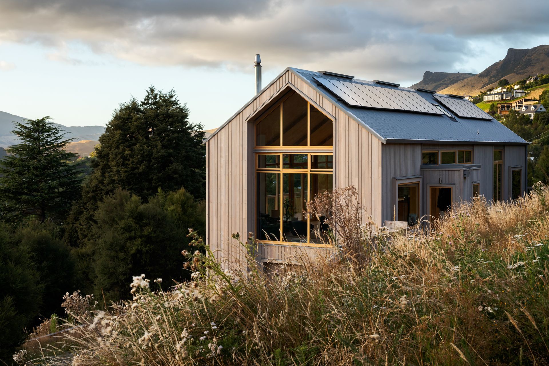 The very simple geometrical form has been punched in and out to create different spaces and uses. A small pop-out creates the entry.