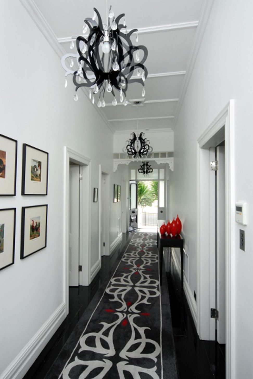 A custom designed floor run to connect with the contempory chandelier pendant lights.