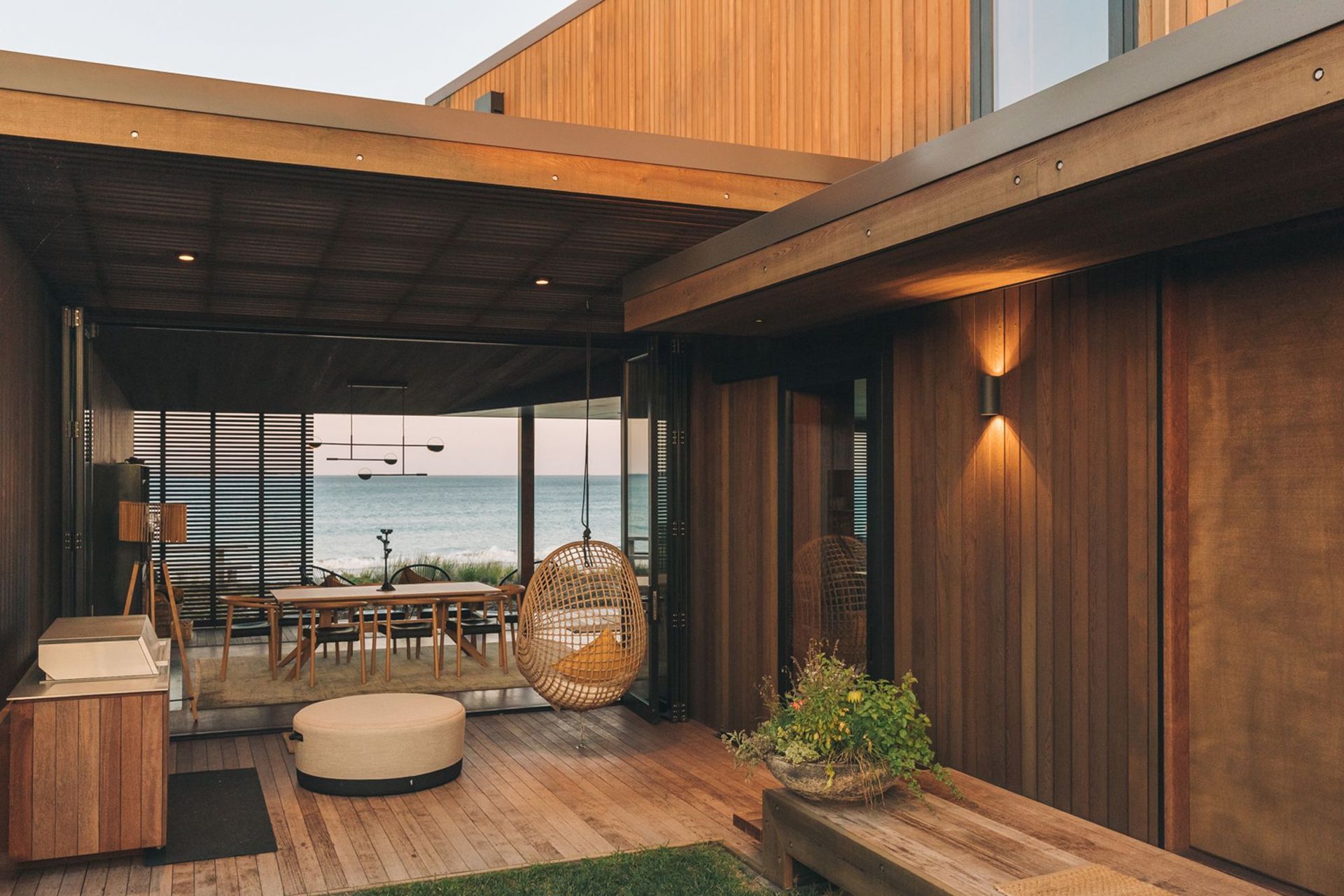 A concealed interior courtyard frames views of the ocean and provides a sheltered outdoor space for entertaining.