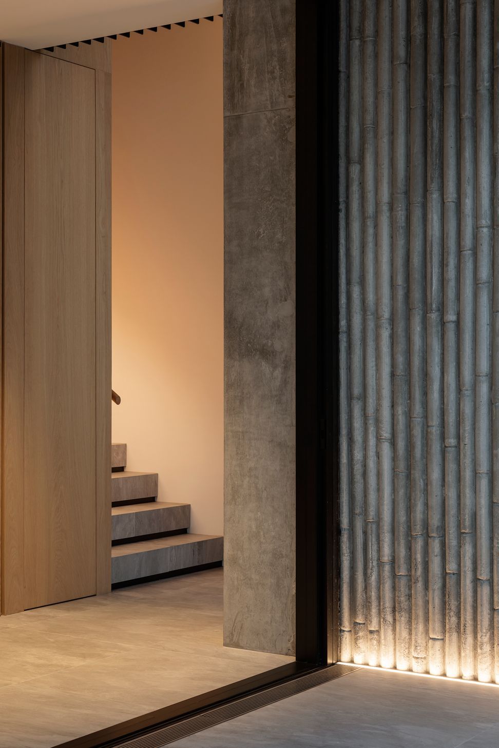 The stairwell leading upstairs from the front entrance.