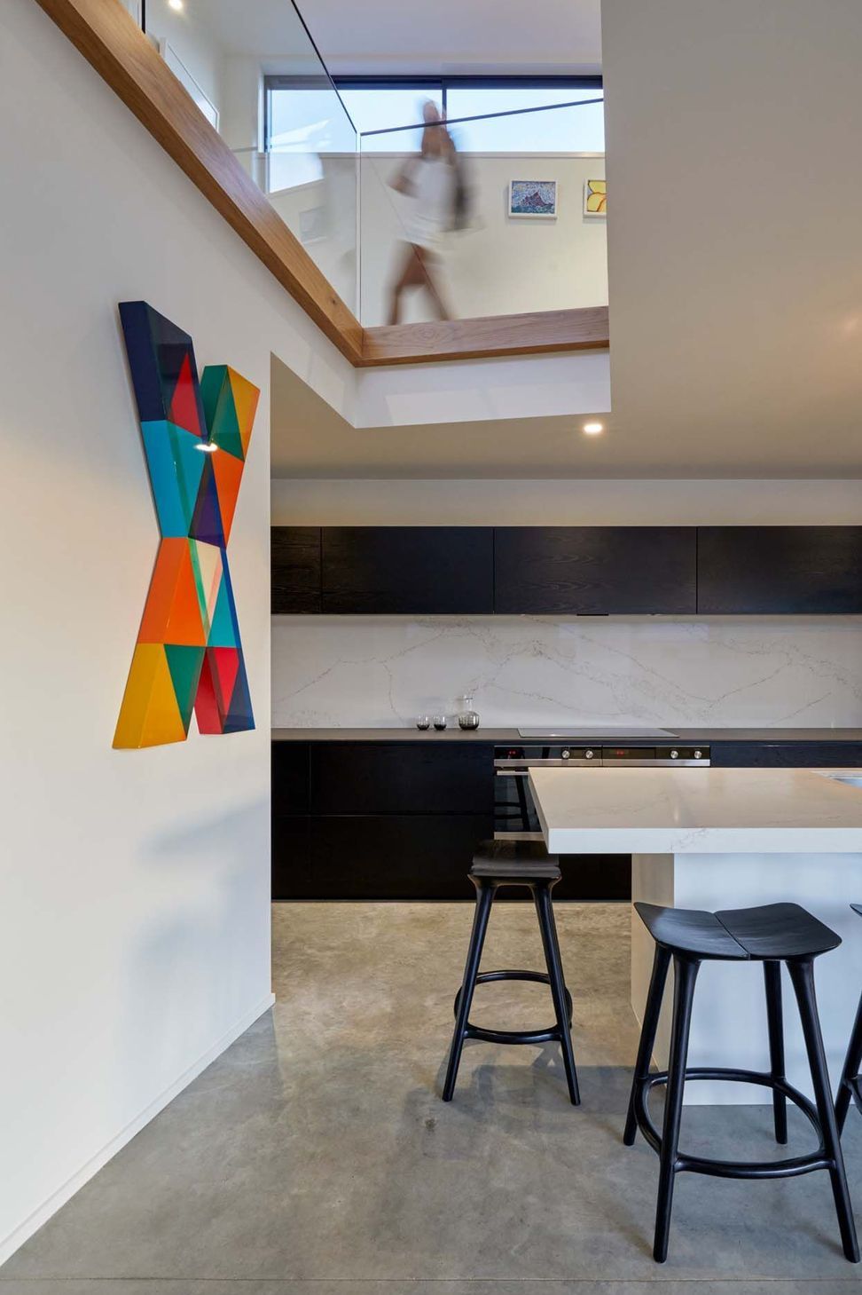A lightwell over the kitchen draws in light and connects the kitchen with the upstairs.