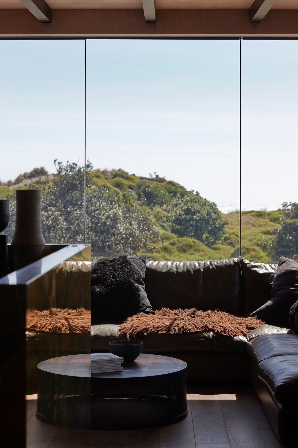 Low-E glass contributes to the feeling that the home is only moments away from being plunged into the elements.
