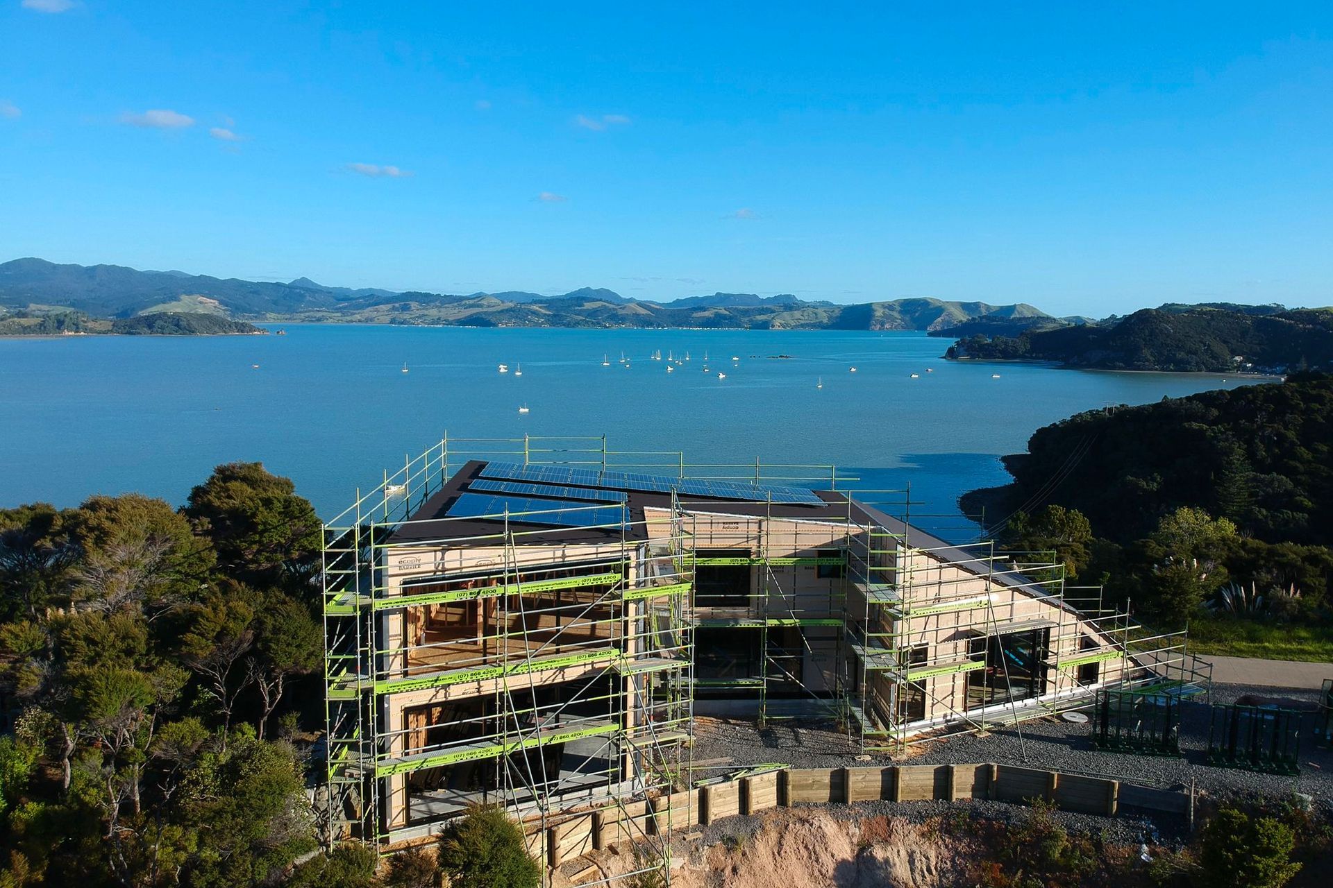 Beautiful Wyuna Bay.  This Kerr Ritchie Architects house built by Steve Wilson Design &amp; Build. We supplied scaffolding and installed roofing in Trimrib® TS .55 COLORSTEEL® MAXX® in ‘Ironsand’   