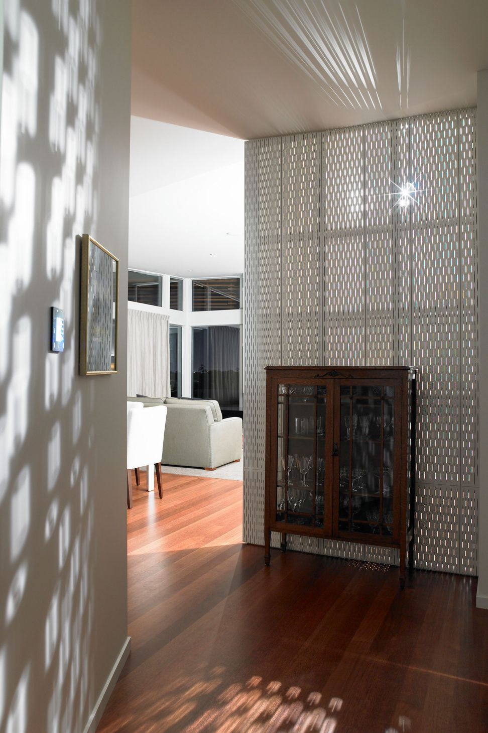 Heritage glass cabinet contrasts with the modernist textures.