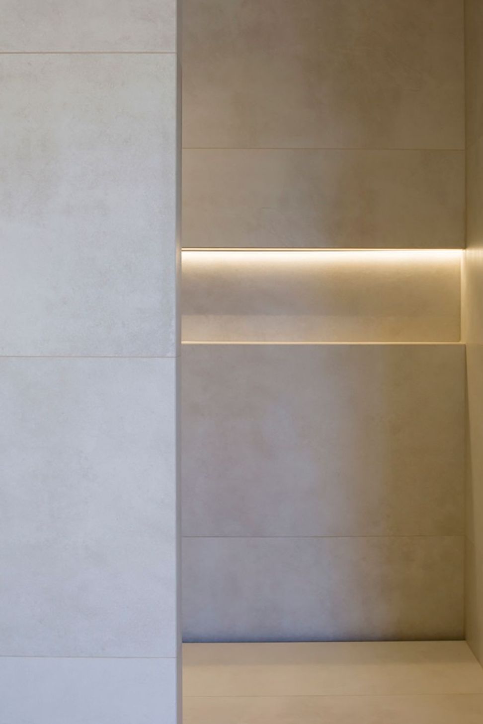 Subtle downlighting emphasises the patterns in the tiling.