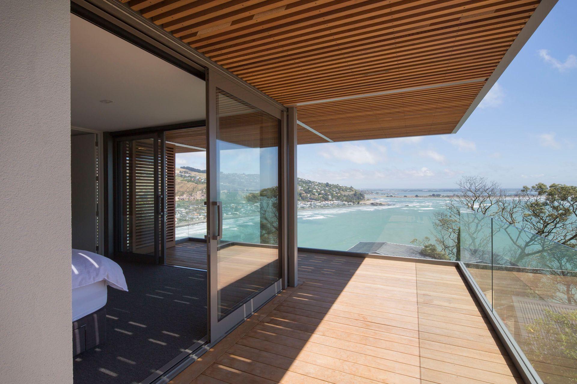 From its north-west corner position, the main bedroom enjoys wide-ranging views towards the Port Hills in the far distance.