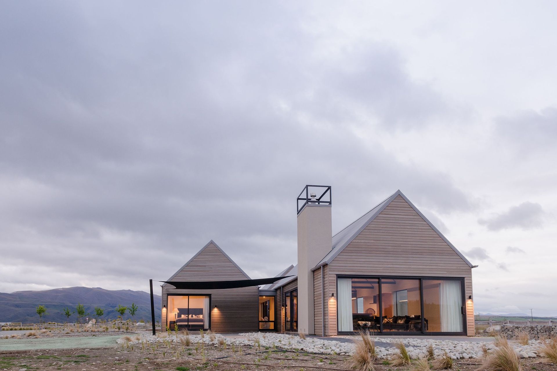The home nestles nicely into the iconic golden setting of the MacKenzie Country. 