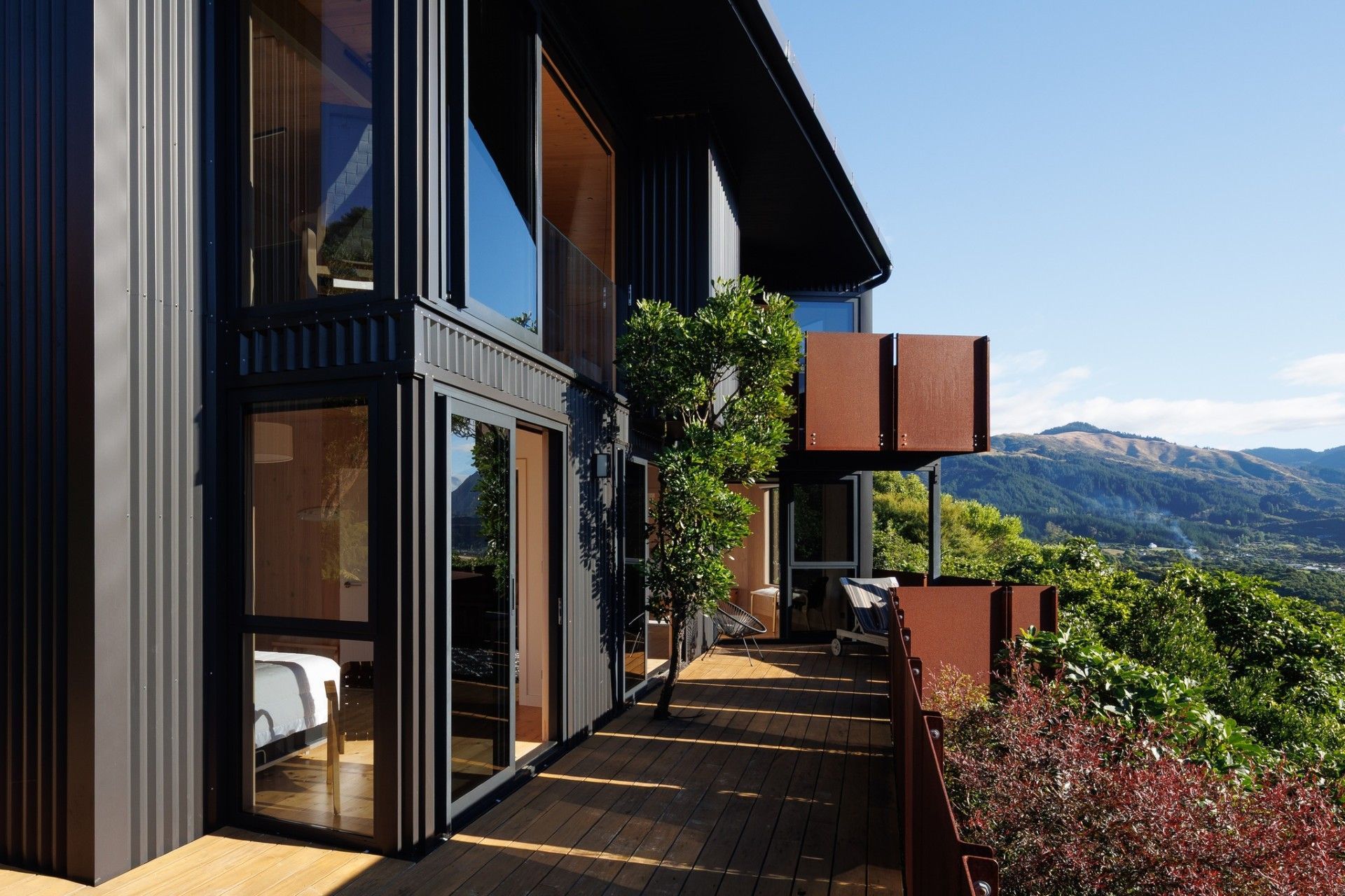 golden-bay-house-07-exterior-deck-corten-lookouts.jpg