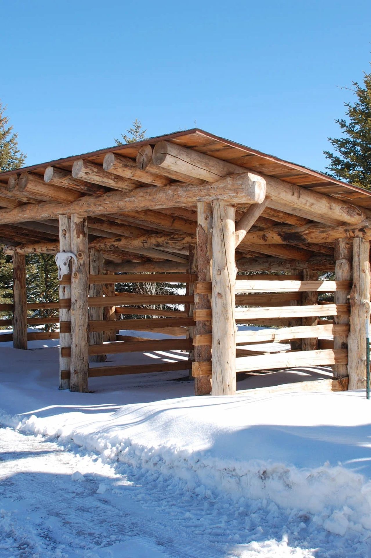 mt-sopris-ranch-log-hay-shed-winter-working-ranch-ap-compressed.jpg