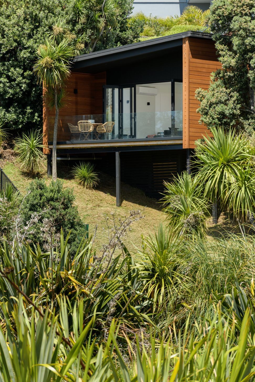 Tree house casa del arbol nestled in pohutukawa trees.