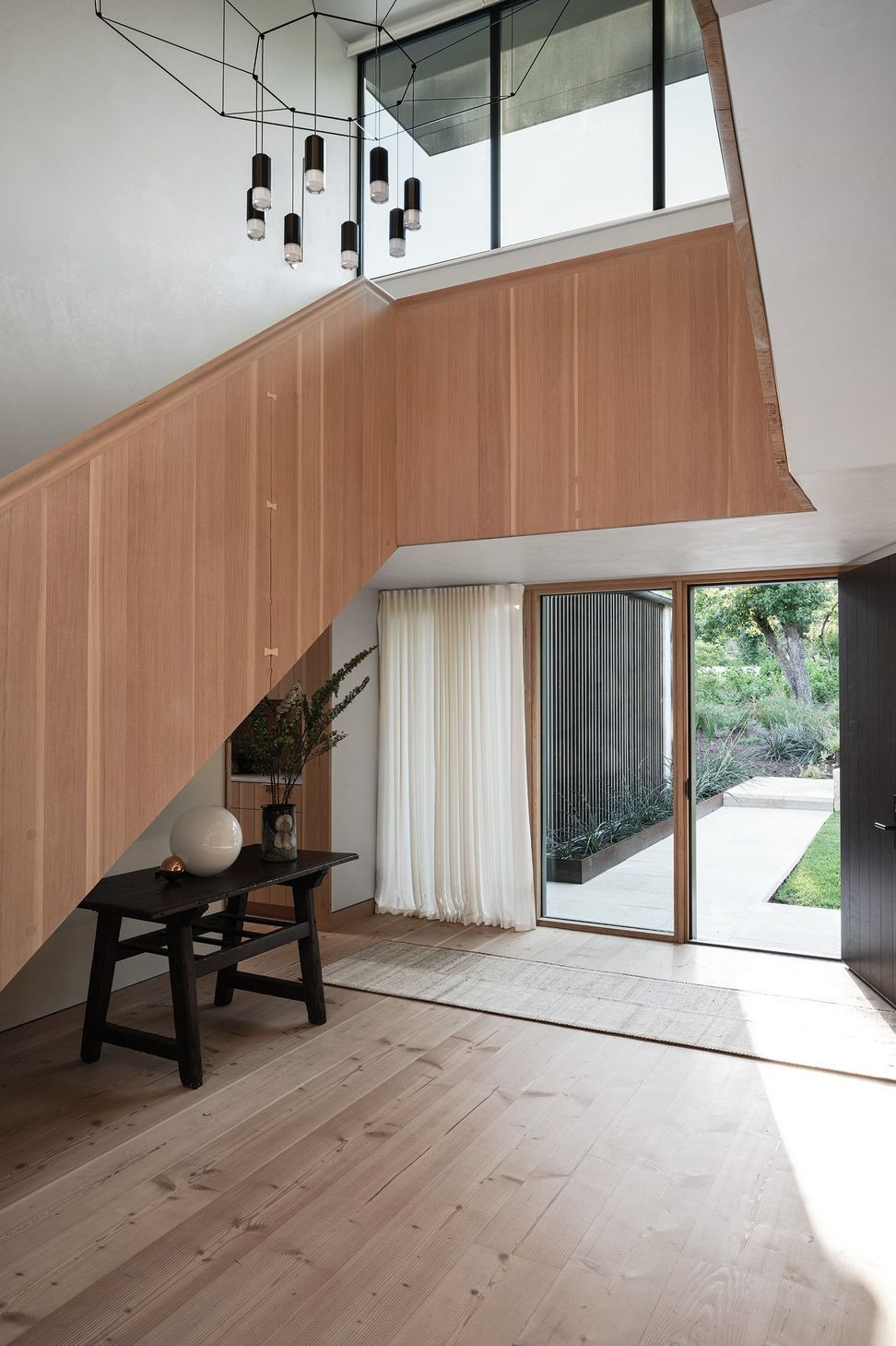 18WestLakeHillsPhoenixCuppettKilpatrickArchitectureandInteriorDesignAustinATXArchitectsaustin-front-entry-custom-stair-1.jpg