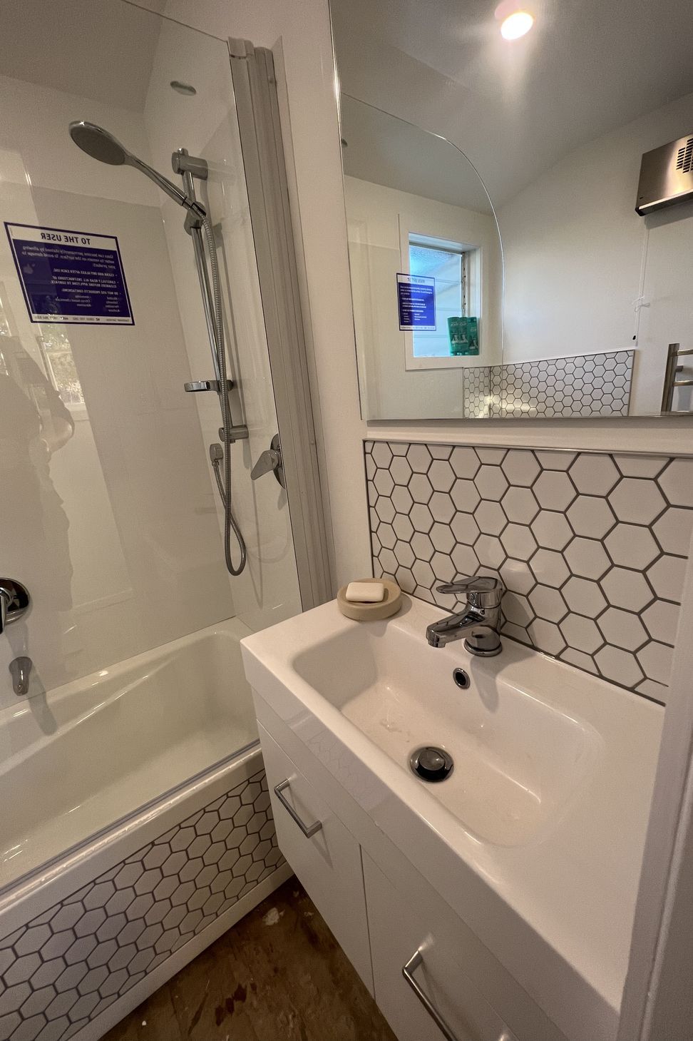 Tiled bath cradle &amp; vanity splashback