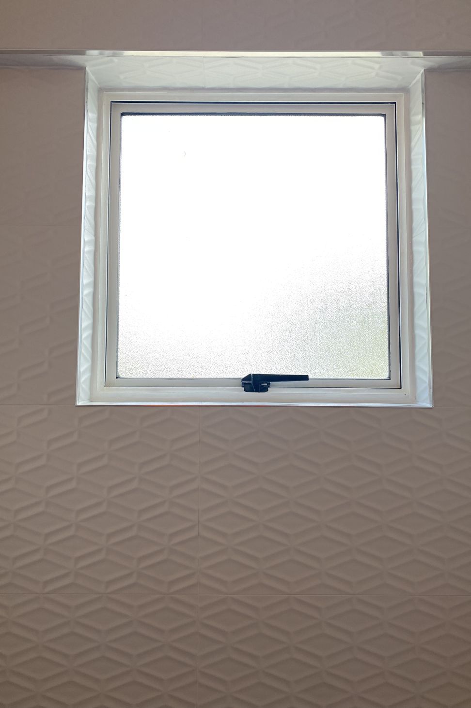 Tiled feature wall and window reveal