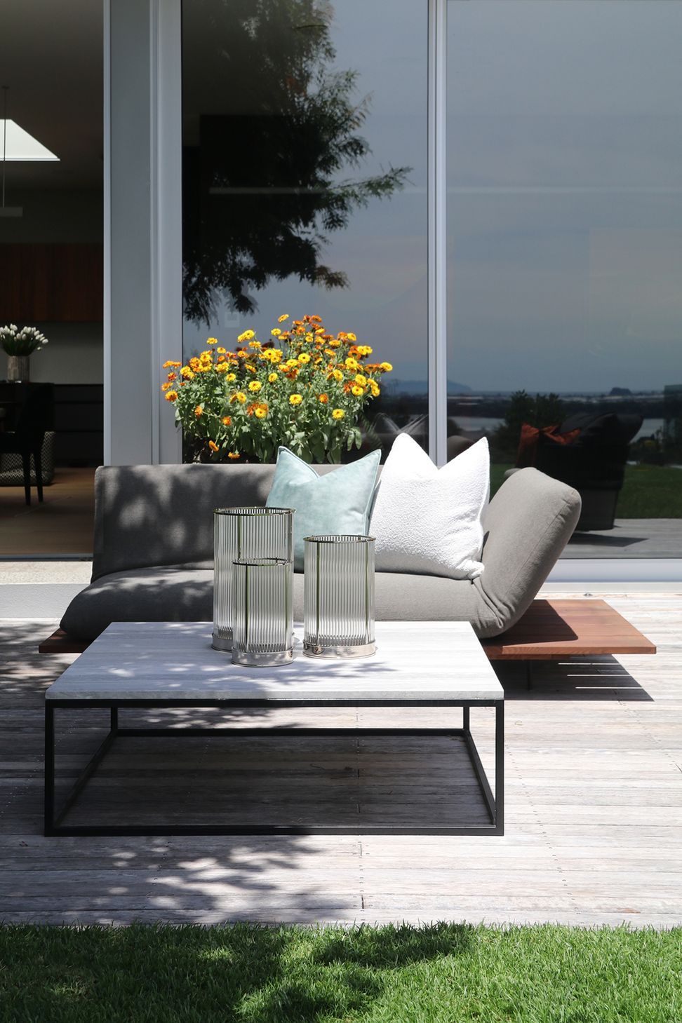 Custom outdoor coffee table with a metal frame &amp; Ocean Travertine top