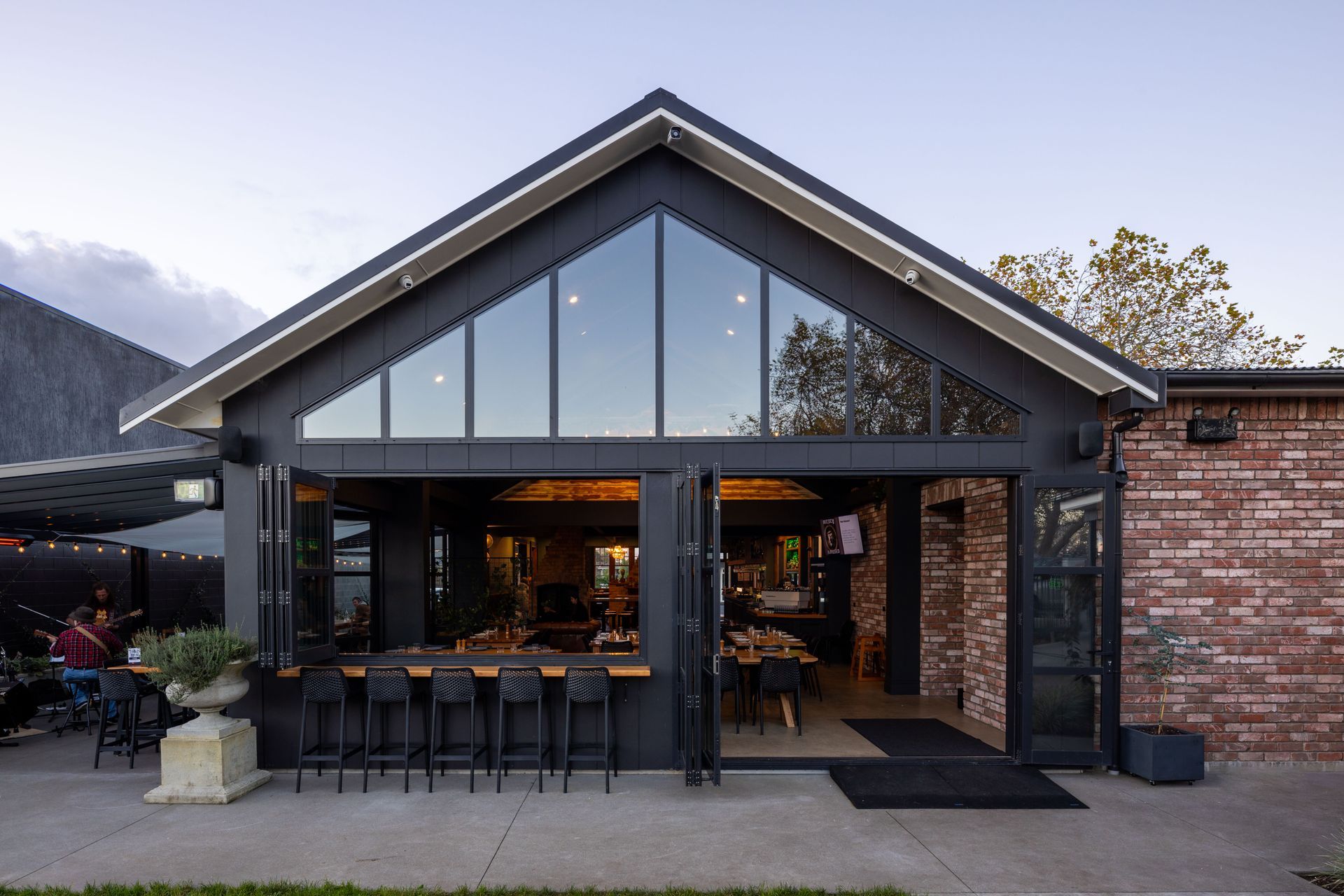 Glazed gable end to outdoor dining area