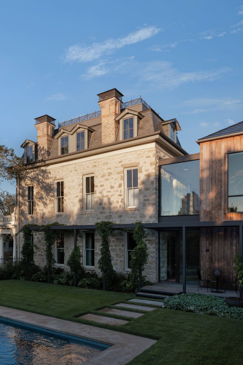 31PastandPresentPlaceCuppettKilpatrickArchitectureandInteriorDesignAustinTexasstone-secondempire-historic-modern-addition-steel-windows-kebony-siding-glass-connec.jpg