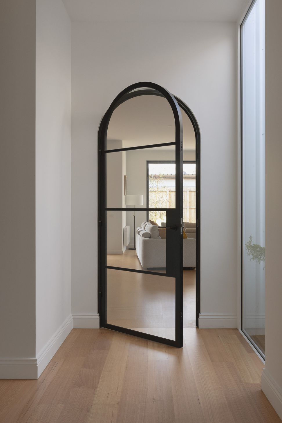 473BlackArchedMetalDoorYarraville.jpg