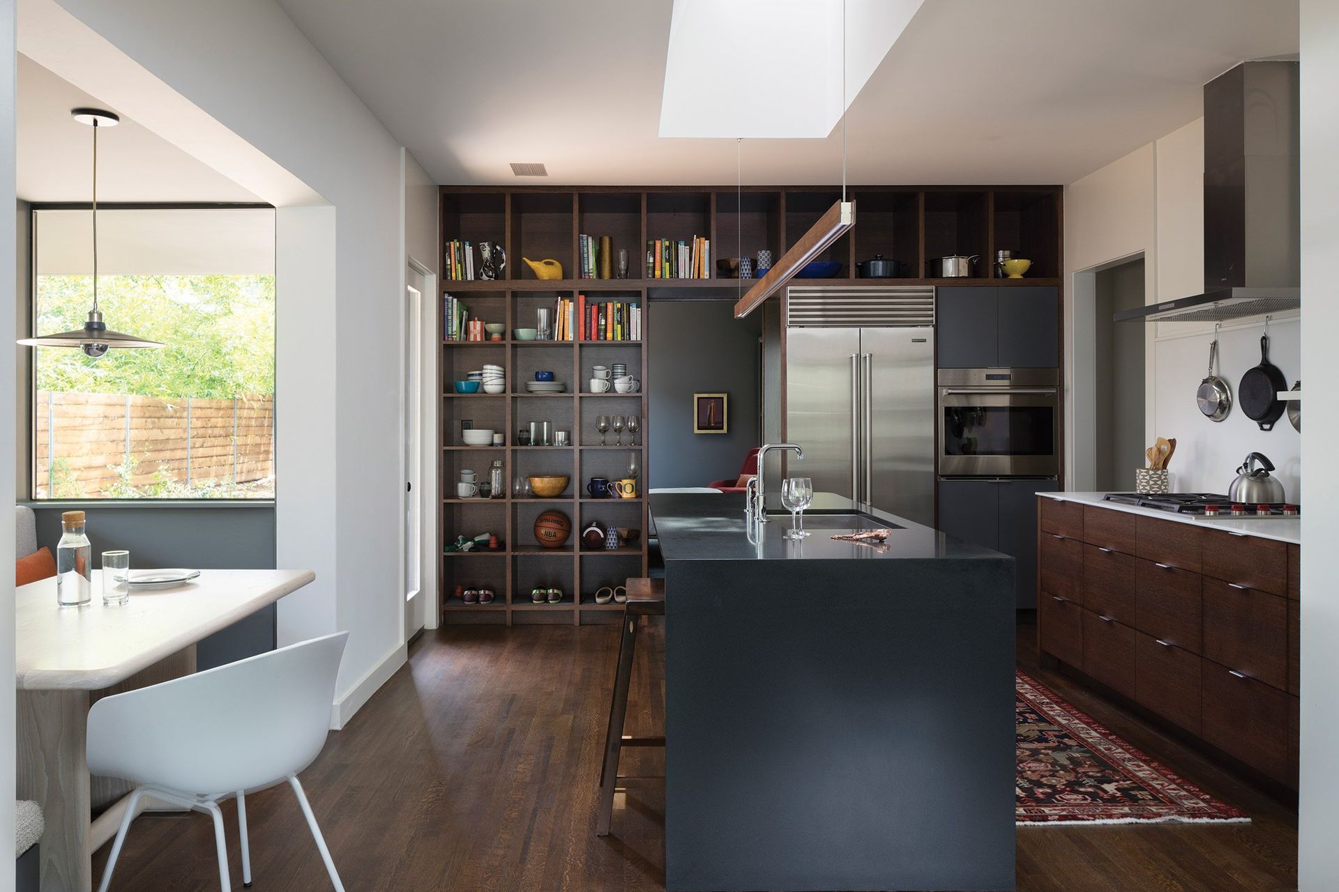 6LittleStacyParkCuppettKilpatrickArchitectureandInteriorDesignaustin-tx-kitchen-island-waterfall-edge-bookshelves.jpg