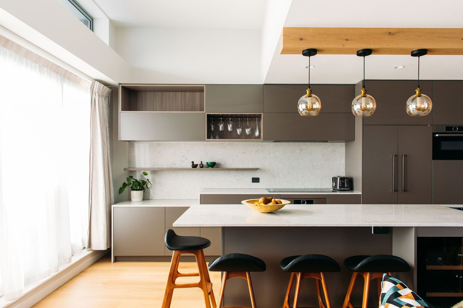The kitchen benches double as workspaces when working from home.