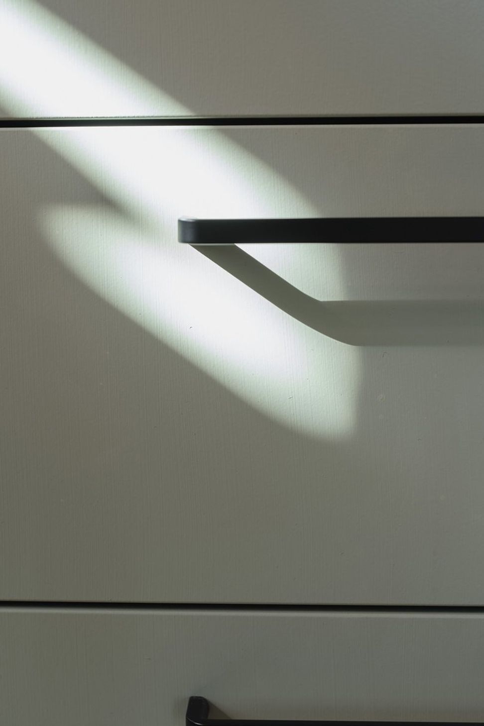 Simple black ‘D’ handles are a stylish, functional and affordable hardware choice.