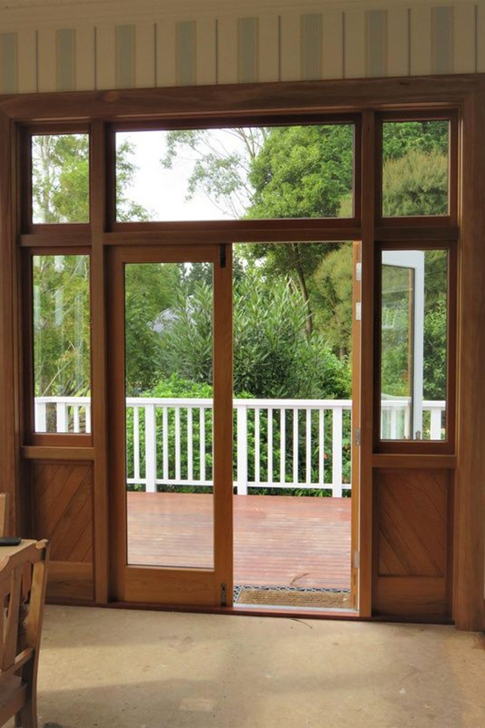 Wooden door with glass and wood detailing