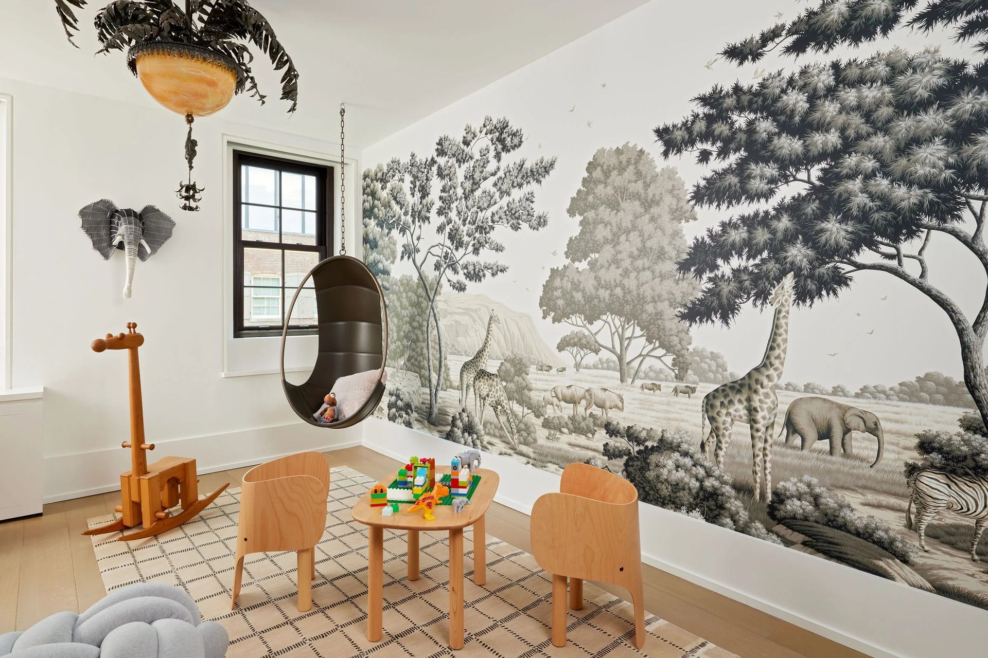 greenwich-avenue-duplexkids-playroomsafari-muralhanging-chair-ap-compressed.jpg
