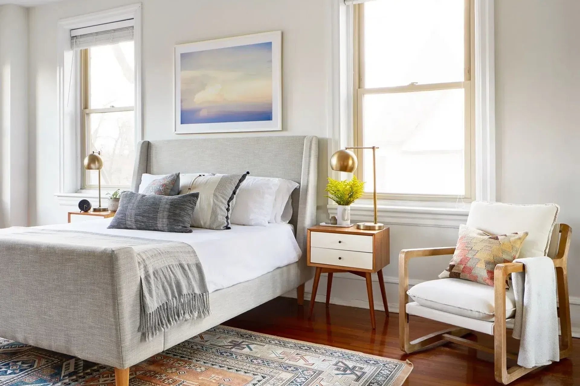 sharp-and-grey-interiors-philadelphia-pa-bright-bedroom-upholstered-bed.webp