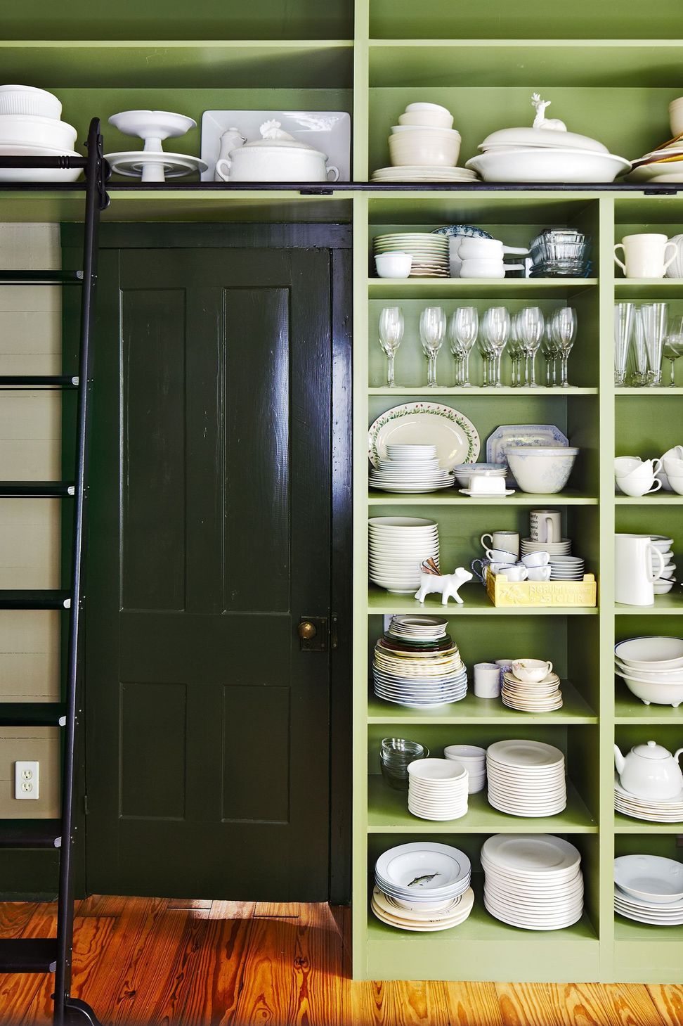 7HistoricHouseCuppettKilpatrickArchitectureandInteriorDesignaustin-tx-kitchen-green-open-shelves-white-dishware-ladder.jpg