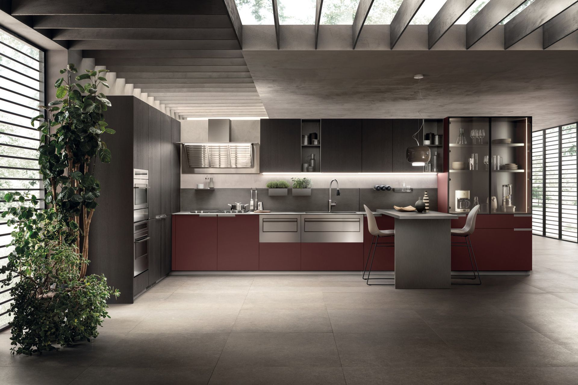 The colours and materials come together to create a special experience here: it’s a pleasure to get to work on a Dark Steel top (12 mm thick), with a built-in washing area and matching wall panel. The Jaipur Red Fenix NTM® used for the base units provides a touch of high class for this clean-cut, functional and impeccable composition.