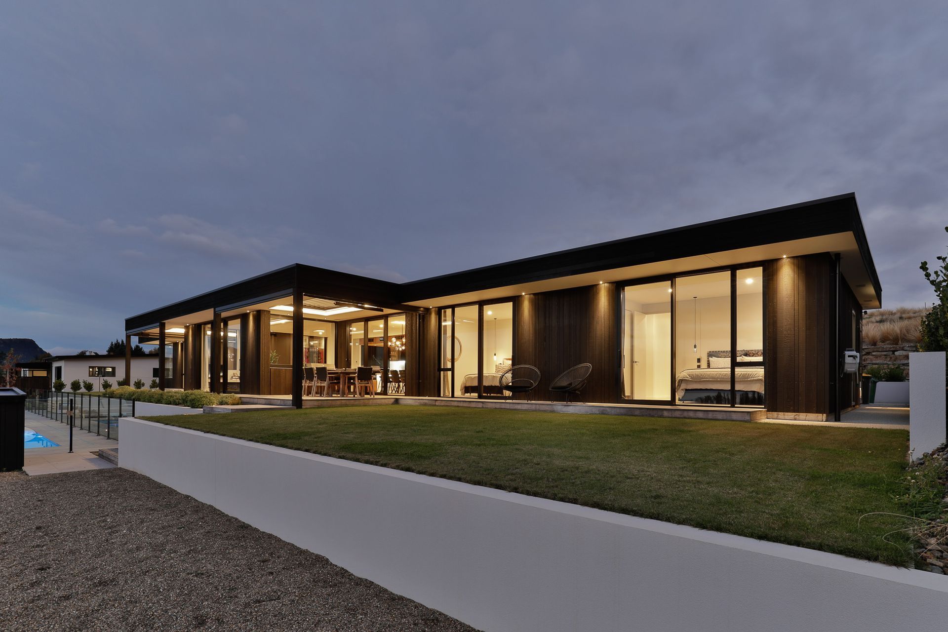 Exterior by night- Guest bedrooms wing.  Interior Design- Kelly @ Archi Build Ltd.